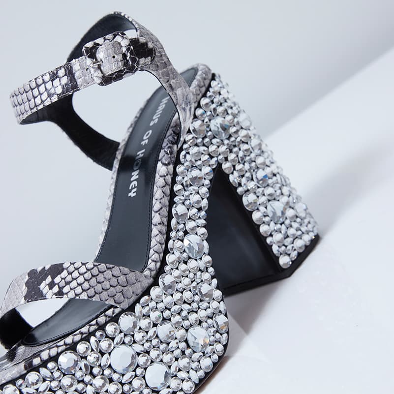 Close-up of Croco Crystal sandal with plateau heel in python profile