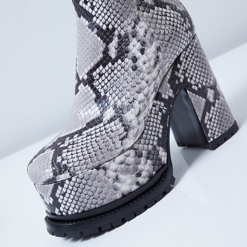 Close-up of Lacquer Doll ankle boot in python print leather profile angle