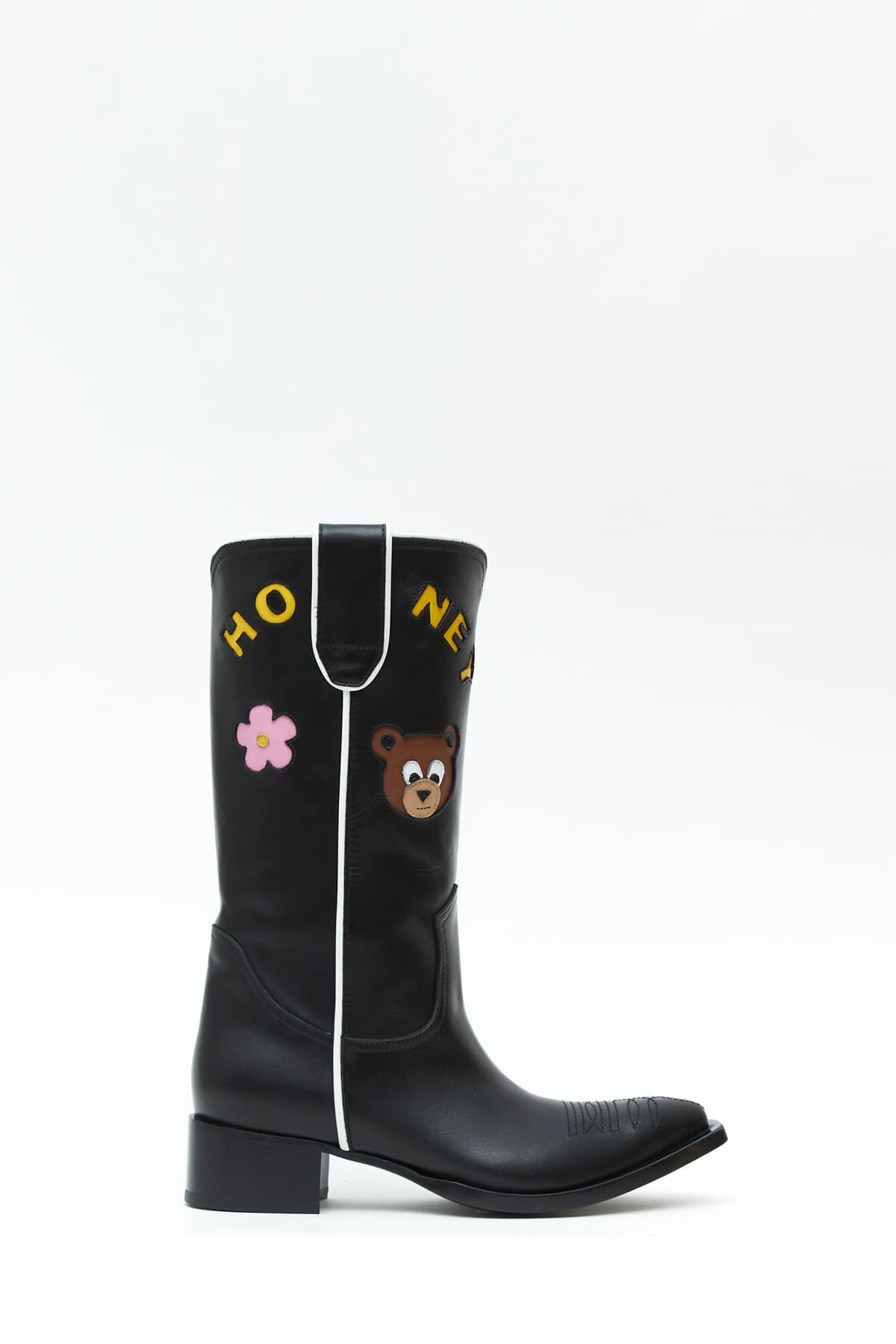 Sideview of Taxhoney boot in black with a bear an flower from the Haus of Honey fall-winter 2023-24